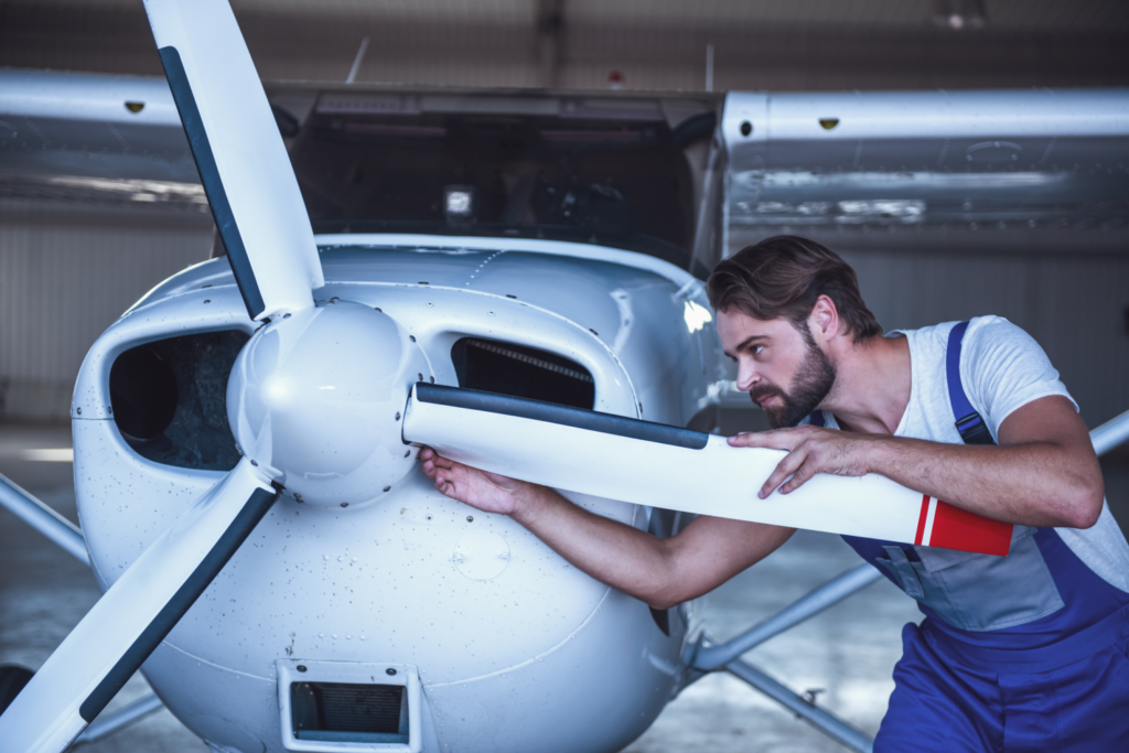 Mechanic inspecting an aircraft